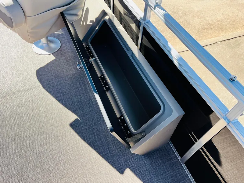 Slide: The Image of Sun Tracker SportFish 22 XP3 2025 boat storage compartment, open and empty. - 49
