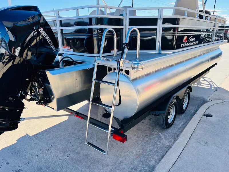 Slide: The Image of 2025 Sun Tracker SportFish 22 XP3 pontoon boat with Mercury engine and ladder. - 8