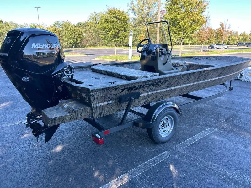 Slide: The Image of 2025 Tracker Grizzly 1860 CC boat on trailer with Mercury outboard motor. - 3