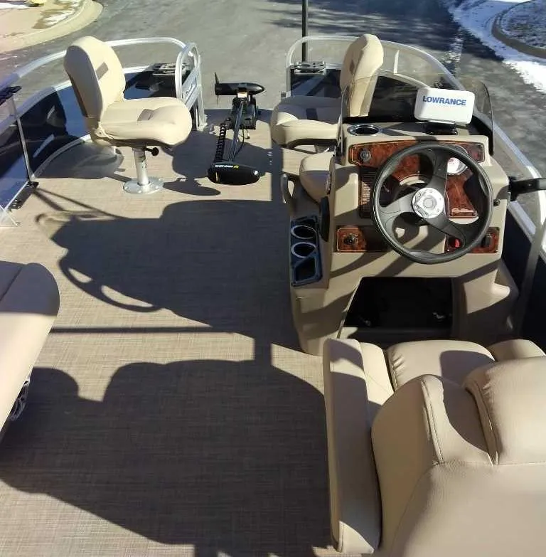 Slide: The Image of 2025 Sun Tracker Bass Buggy 16 XL Select interior with steering wheel and seating. - 3