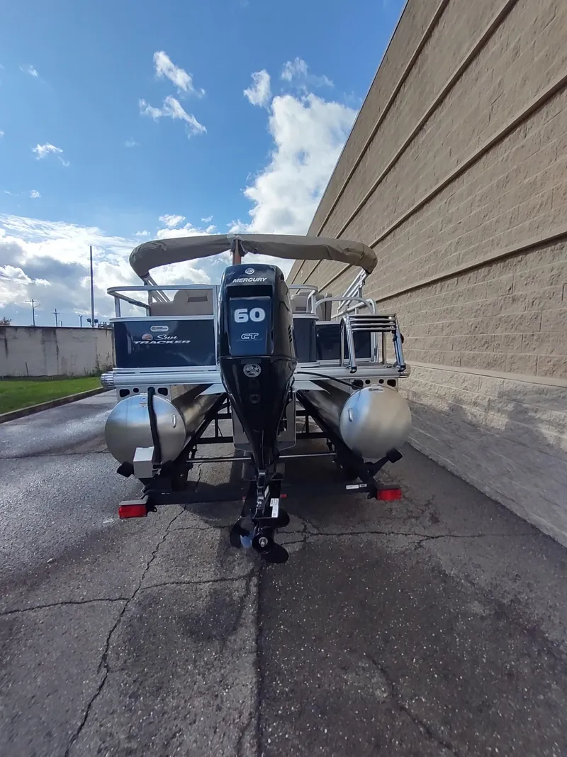 Slide: The Image of 2025 Sun Tracker Bass Buggy 18 DLX pontoon boat with 60 HP engine. - 5