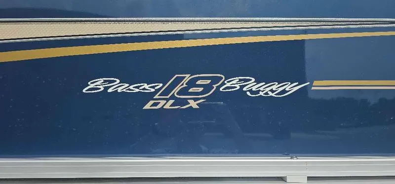 Slide: The Image of 2025 Sun Tracker Bass Buggy 18 DLX logo on blue background. - 2