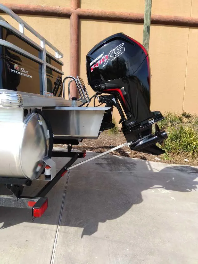 Slide: The Image of 2025 Sun Tracker SportFish 20 DLX with powerful outboard motor. - 6