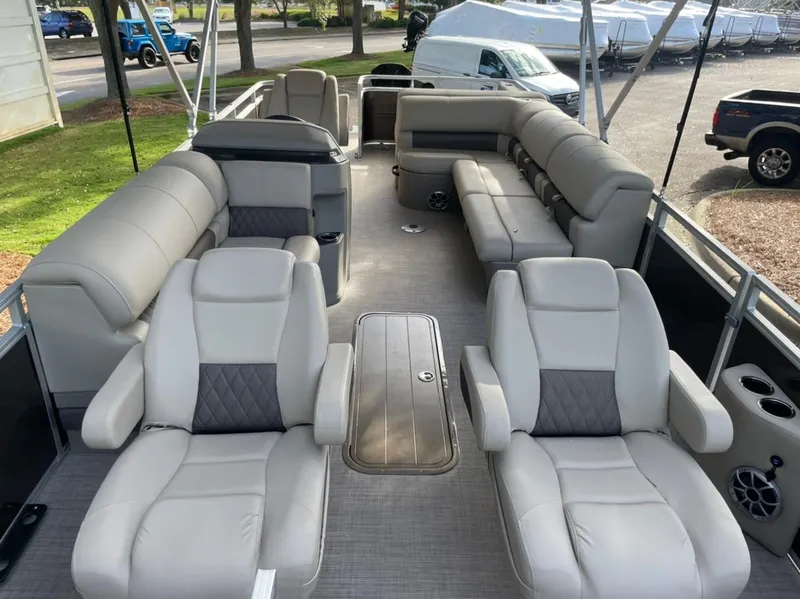 Slide: The Image of 2025 Sun Tracker Sportfish 24 XP3 pontoon boat interior with plush seating. - 3
