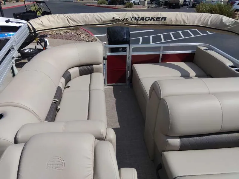 Slide: The Image of 2025 Sun Tracker Party Barge 22 RF DLX with beige seating and spacious layout. - 4