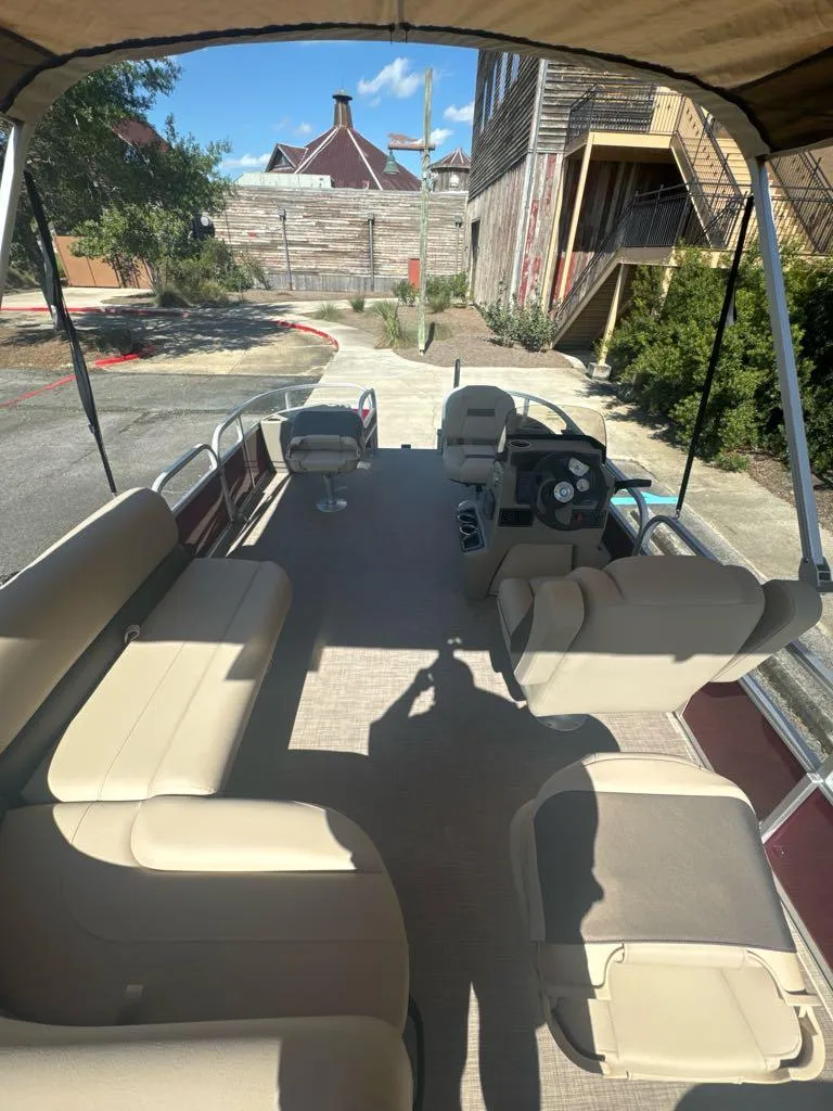 Slide: The Image of 2025 Sun Tracker Bass Buggy 18 DLX pontoon boat with spacious seating and canopy. - 6