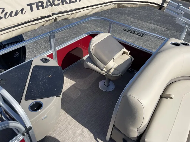 Slide: The Image of 2025 Sun Tracker Bass Buggy 18 DLX interior with seating and console. - 12