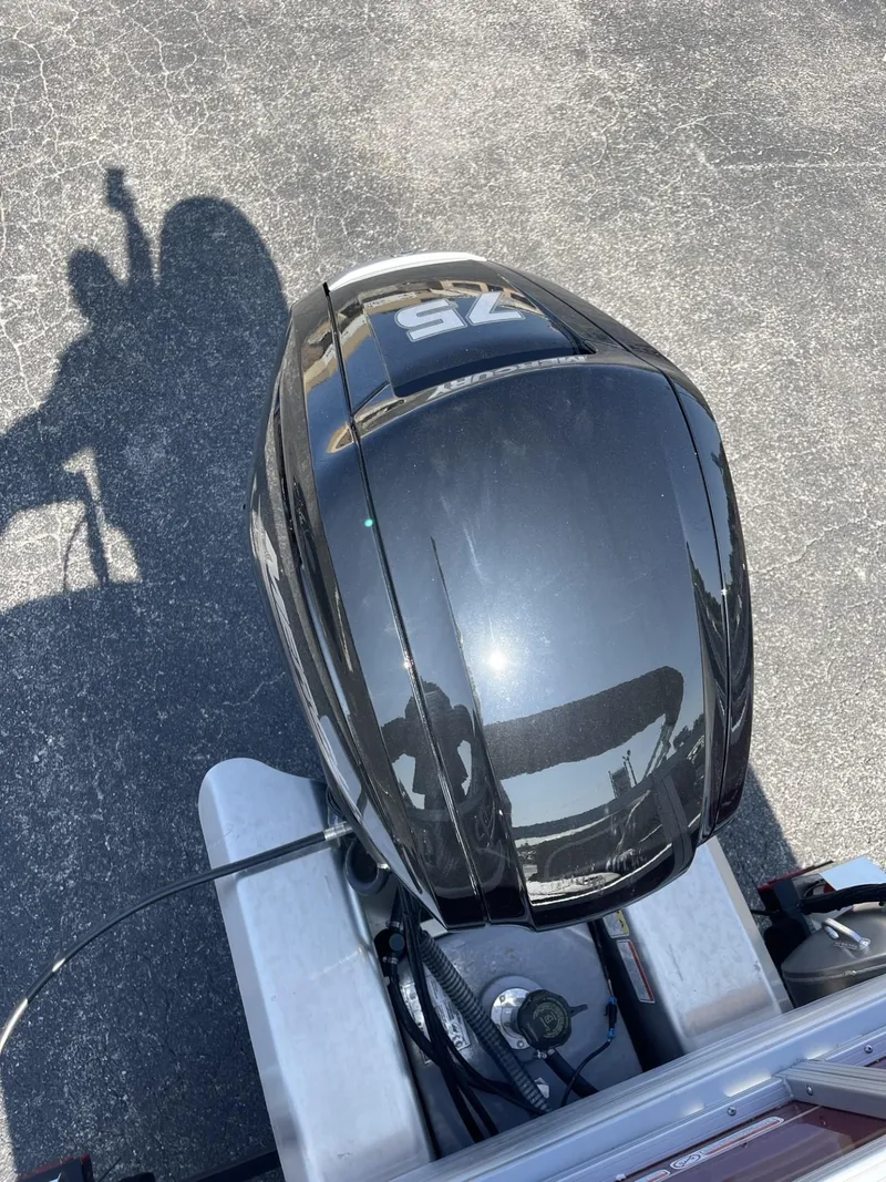 Slide: The Image of 2025 Sun Tracker Bass Buggy 18 DLX outboard motor, top view. - 14