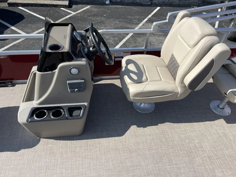 Slide: The Image of 2025 Sun Tracker Bass Buggy 18 DLX boat interior with steering console and seating. - 8