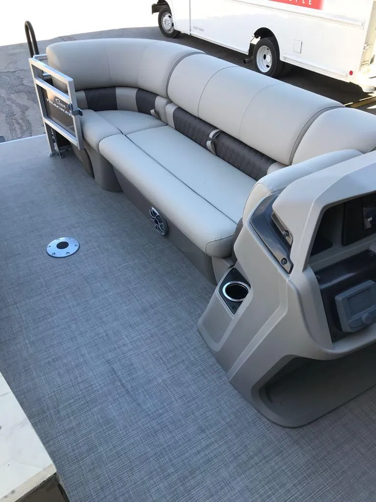 Slide: The Image of 2025 Sun Tracker SportFish 22 DLX pontoon boat interior with gray seating and console. - 12