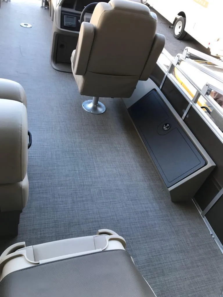 Slide: The Image of 2025 Sun Tracker SportFish 22 DLX interior with seating and storage. - 14