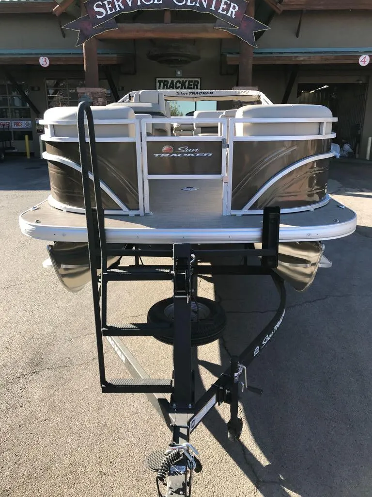 Slide: The Image of 2025 Sun Tracker SportFish 22 DLX pontoon boat at service center. - 6
