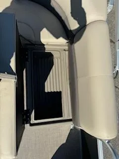 Slide: The Image of 2025 Sun Tracker Party Barge 18 DLX seating with storage compartment. - 10