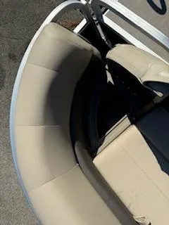 Slide: The Image of 2025 Sun Tracker Party Barge 18 DLX seating area with beige upholstery. - 14