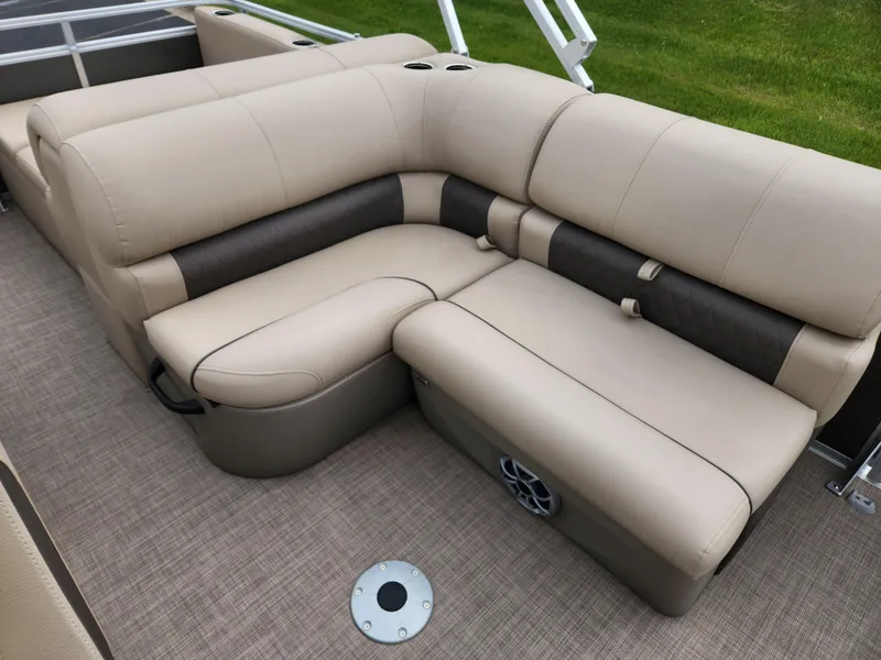 Slide: The Image of 2025 Sun Tracker Party Barge 22 RF DLX interior with beige and brown seating. - 6