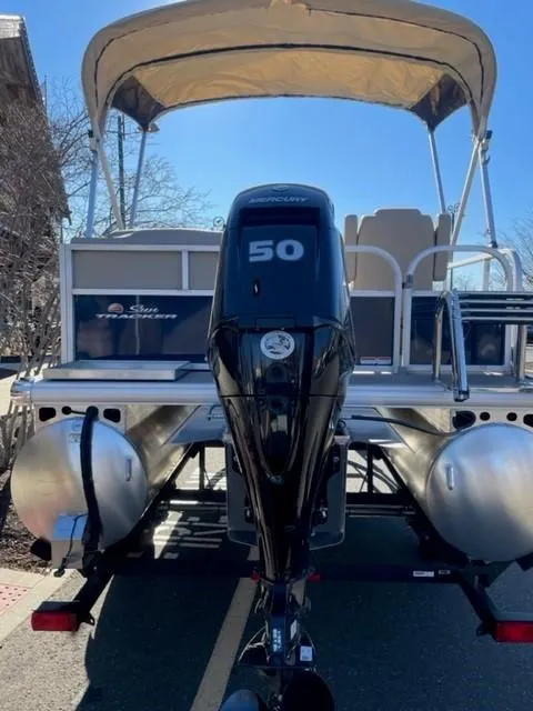 Slide: The Image of 2025 Sun Tracker Bass Buggy 16 XL Select pontoon boat with 50 HP engine. - 2
