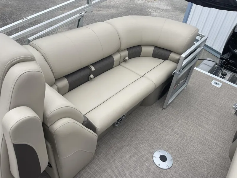 Slide: The Image of 2025 Sun Tracker Party Barge 22 DLX with beige seating and spacious deck. - 12