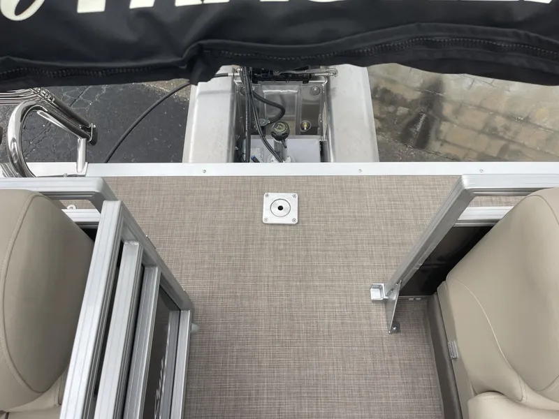 Slide: The Image of 2025 Sun Tracker Party Barge 22 DLX deck with seating and railing. - 14