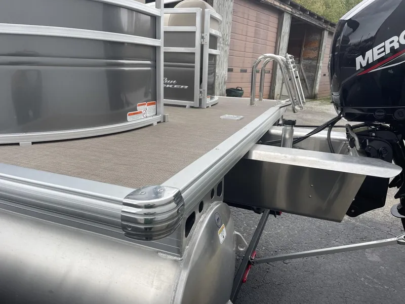 Slide: The Image of 2025 Sun Tracker Party Barge 22 DLX pontoon boat with Mercury outboard motor. - 3