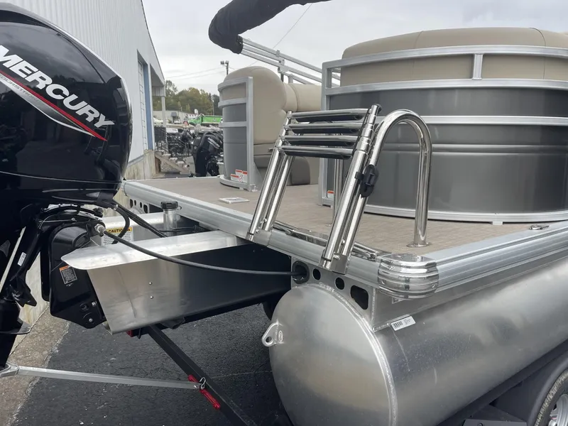 Slide: The Image of 2025 Sun Tracker Party Barge 22 DLX pontoon boat with Mercury engine and ladder. - 4