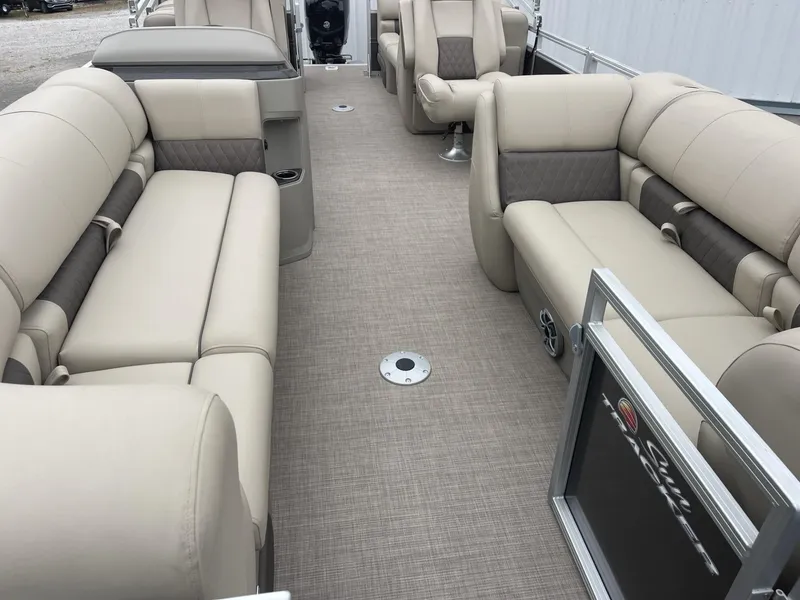 Slide: The Image of 2025 Sun Tracker Party Barge 22 DLX interior with beige seating and spacious layout. - 6