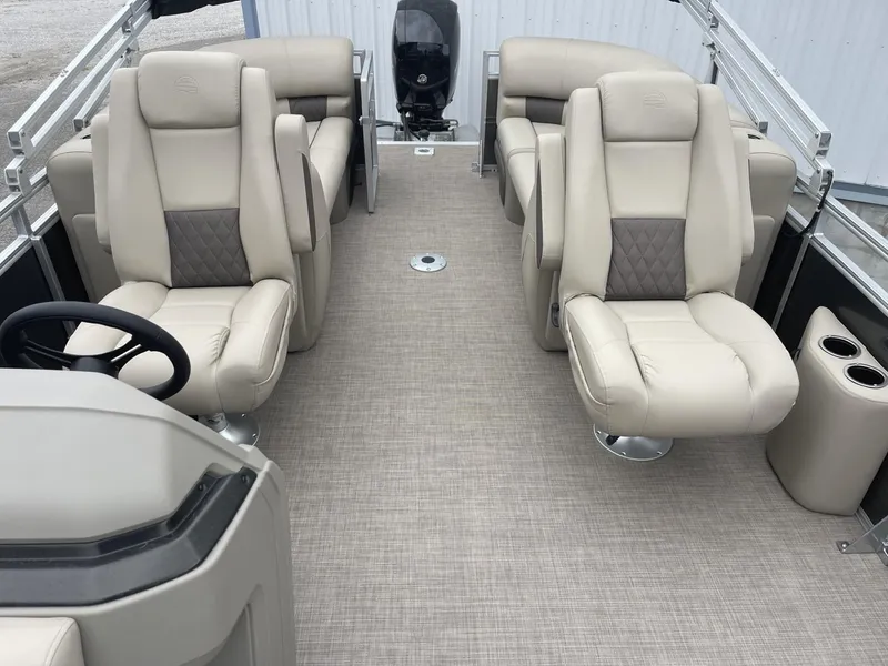 Slide: The Image of 2025 Sun Tracker Party Barge 22 DLX interior with plush seating and modern design. - 9