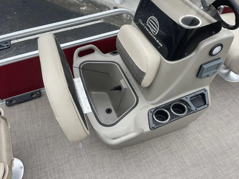 Slide: The Image of 2025 Sun Tracker Bass Buggy 16 XL Select boat console with storage and cup holders. - 13