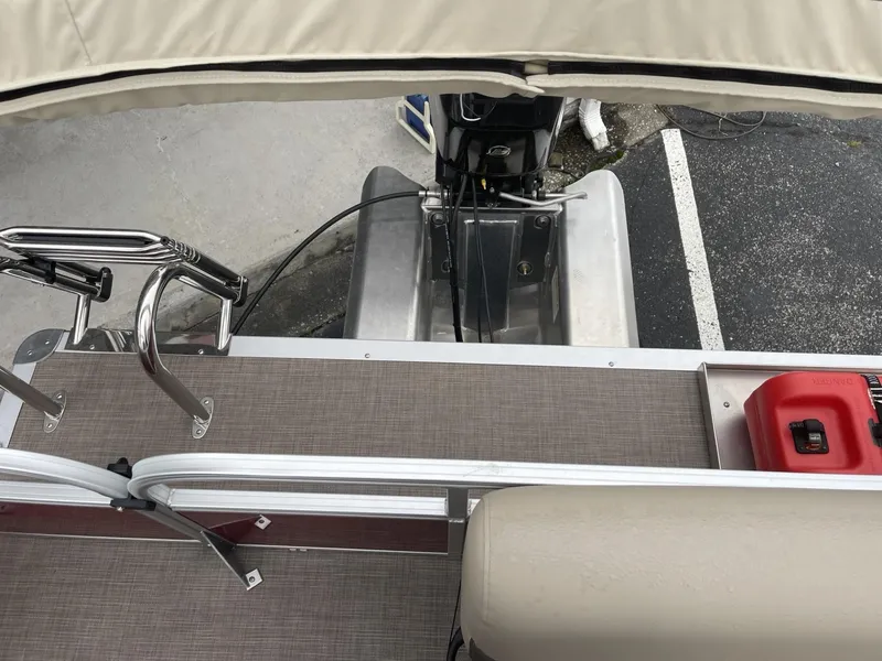 Slide: The Image of 2025 Sun Tracker Bass Buggy 16 XL Select boat deck with motor and fuel tank. - 14