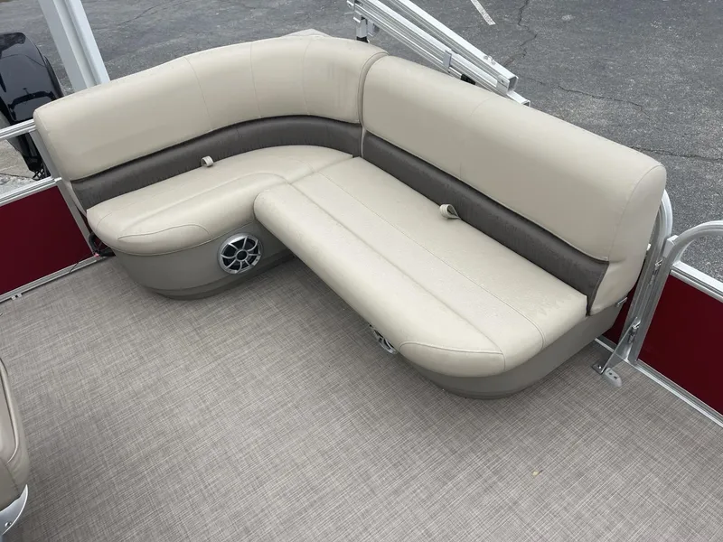 Slide: The Image of 2025 Sun Tracker Bass Buggy 16 XL Select pontoon boat seating, beige and brown upholstery. - 8