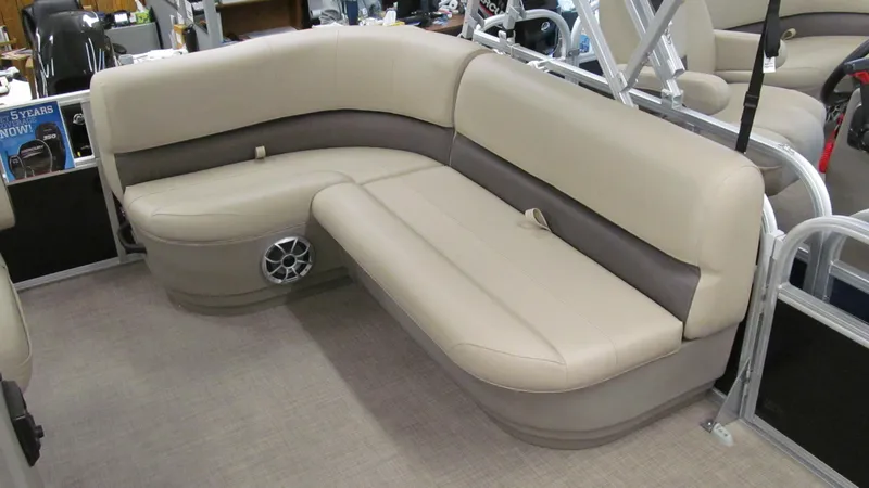 Slide: The Image of 2025 Sun Tracker Party Barge 16 DLX interior seating with beige upholstery. - 5