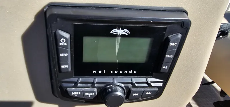 Slide: The Image of Control panel of a 2025 Sun Tracker Party Barge 16 DLX with Wet Sounds audio system. - 14