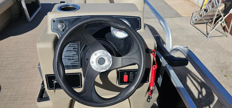 Slide: The Image of Steering console of 2025 Sun Tracker Party Barge 16 DLX pontoon boat. - 16