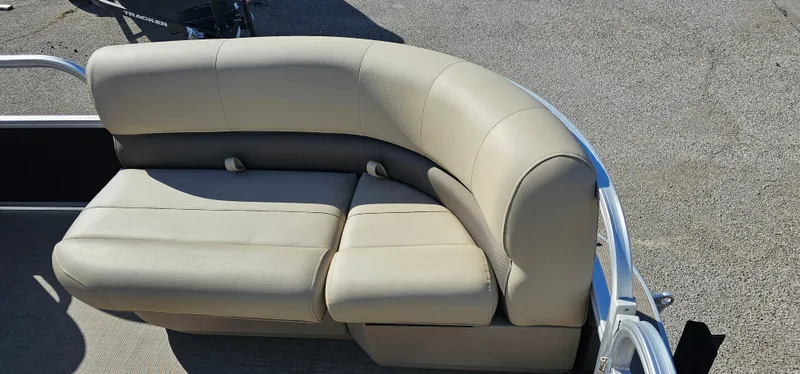 Slide: The Image of 2025 Sun Tracker Party Barge 16 DLX beige seating on deck. - 9