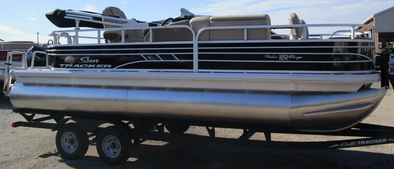 Slide: The Image of 2025 Sun Tracker Fishin' Barge 20 DLX pontoon boat on trailer. - 49