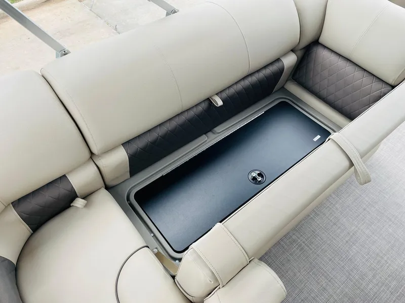 Slide: The Image of 2025 Sun Tracker SportFish 20 DLX boat seating with storage compartment. - 20