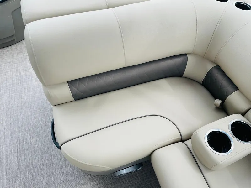Slide: The Image of 2025 Sun Tracker SportFish 20 DLX beige boat seating with cup holders. - 22