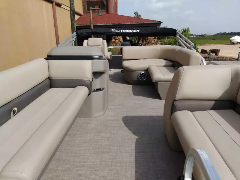 Slide: The Image of 2025 Sun Tracker Party Barge 18 DLX with spacious seating and modern design. - 2