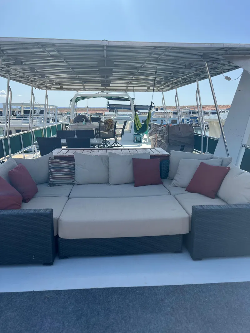 Slide: The Image of 2002 Sharpe houseboat with spacious deck, outdoor seating, and canopy. - 38