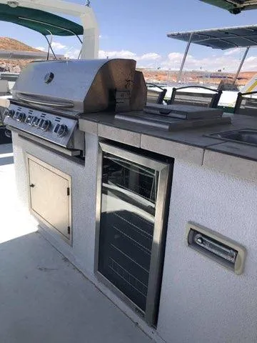Slide: The Image of Outdoor kitchen on 2002 Sharpe houseboat with grill and mini fridge. - 4