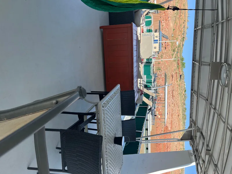 Slide: The Image of Outdoor deck of 2002 Sharpe houseboat with table, chairs, and scenic view. - 46