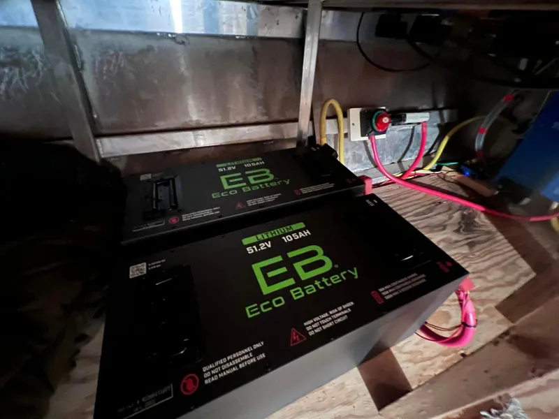 Slide: The Image of Eco batteries installed in a 2002 Sharpe houseboat, showcasing electrical setup. - 6