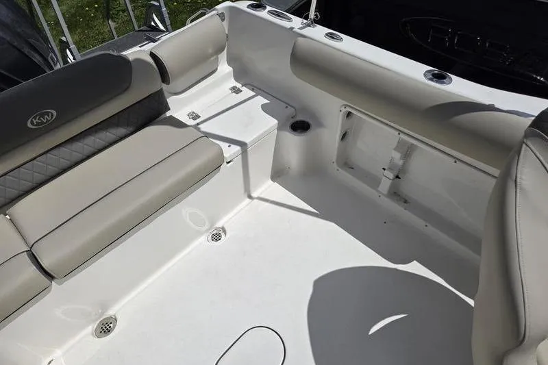 Slide: The Image of Interior of 2025 Key West 203 DFS boat with cushioned seating and storage. - 11