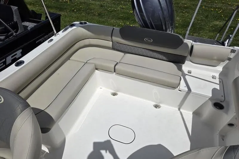 Slide: The Image of Interior of 2025 Key West 203 DFS boat with cushioned seating and spacious layout. - 12