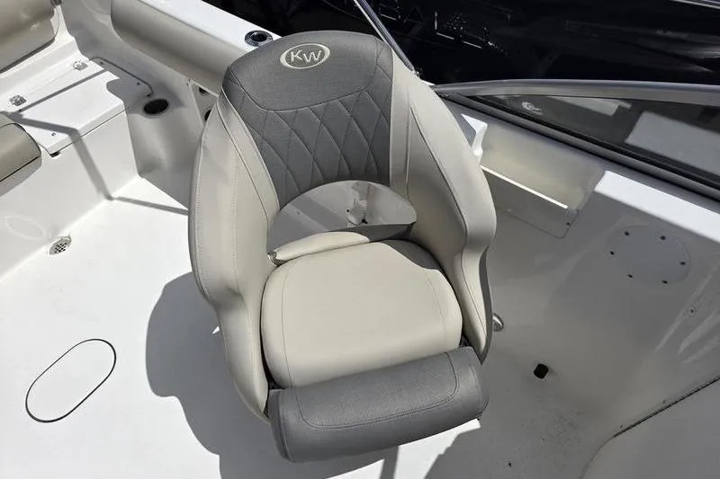 Slide: The Image of Boat seat on 2025 Key West 203 DFS, featuring gray and white upholstery. - 7