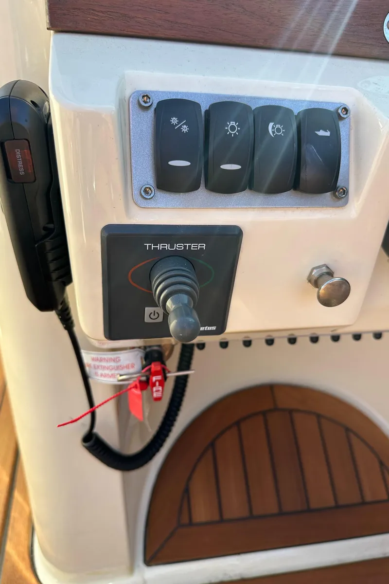 Slide: The Image of Control panel of 2013 Chris-Craft Launch 25 boat with switches and thruster control. - 27