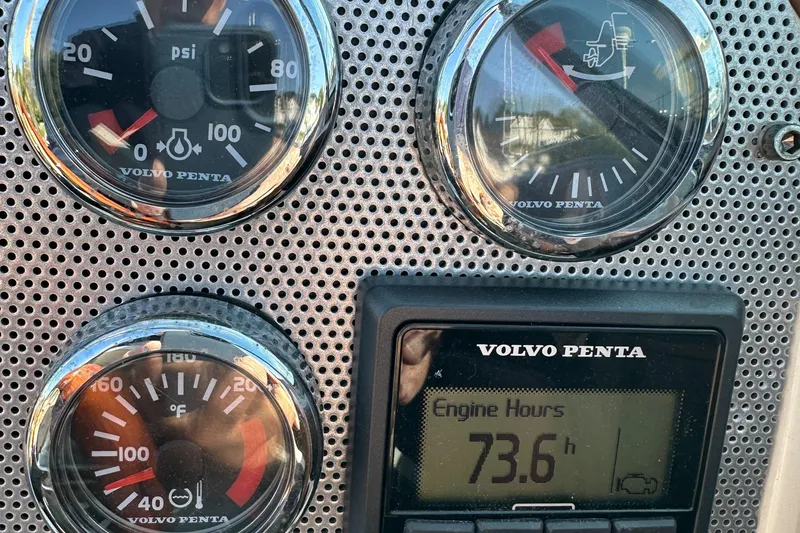 Slide: The Image of Dashboard of 2013 Chris-Craft Launch 25 showing engine hours and gauges. - 28