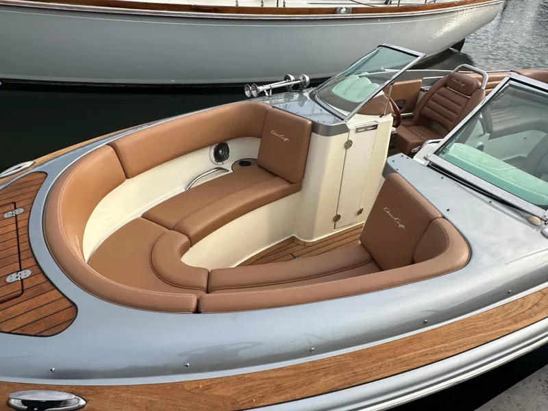 Slide: The Image of 2013 Chris-Craft Launch 25 boat with elegant tan leather seating and wood accents. - 7