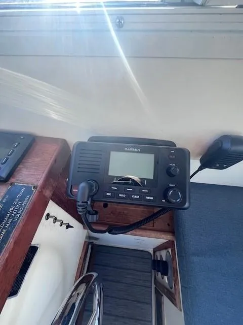 Slide: The Image of Garmin marine radio on 1989 Blue Seas Out Island Explorer boat dashboard. - 21