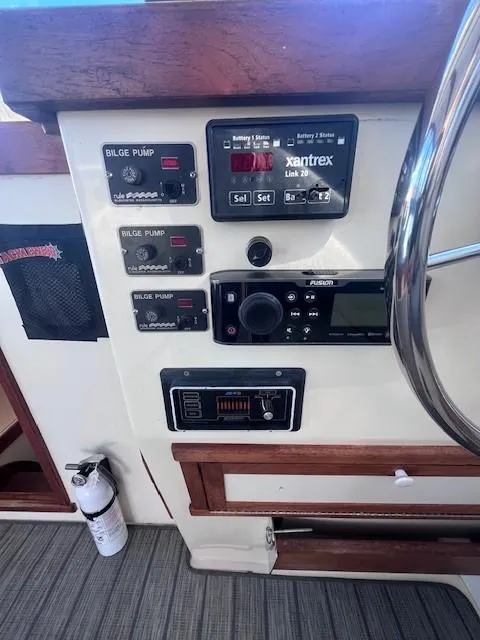 Slide: The Image of Control panel of 1989 Blue Seas Out Island Explorer boat with bilge pump switches. - 23