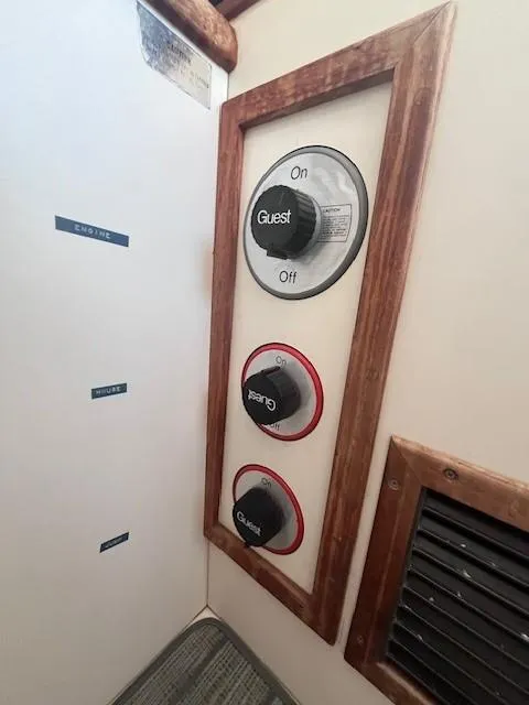 Slide: The Image of Control panel of 1989 Blue Seas Out Island Explorer boat with labeled switches. - 29